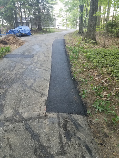 We saw cut and removed existing asphalt and replace with new asphalt.